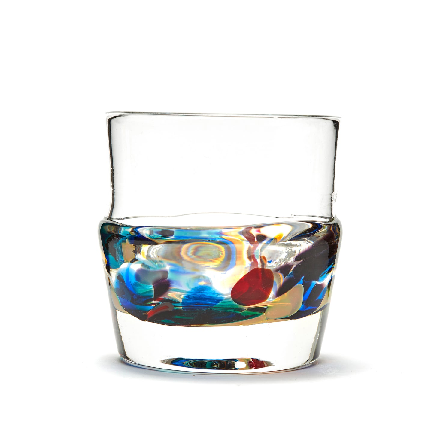 Load image into Gallery viewer, Hand blown glass whiskey glass, clear with a swirl of red, blue, purple, and green glass on the bottom. Colour combination is called &amp;quot;Carnival.&amp;quot;
