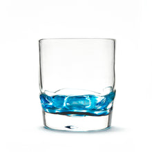 Load image into Gallery viewer, Hand blown glass whiskey glass, clear with a swirl of teal blue glass on the bottom. Colour combination is called &quot;Ocean Wave.&quot;