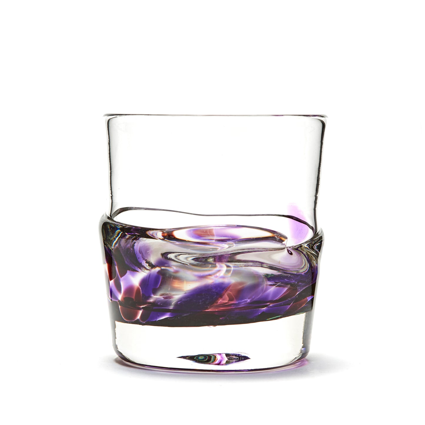 Load image into Gallery viewer, Hand blown glass whiskey glass, clear with a swirl of purple and cranberry glass on the bottom. Colour combination is called &amp;quot;Amethyst.&amp;quot;
