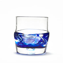 Load image into Gallery viewer, Hand blown glass whiskey glass, clear with a swirl of cobalt blue glass on the bottom.