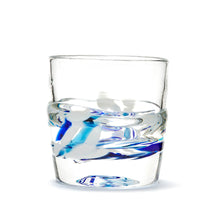 Load image into Gallery viewer, Hand blown glass whiskey glass, clear with a swirl of cobalt blue, teal blue, and white glass on the bottom. Colour combination is called &quot;Winter.&quot;