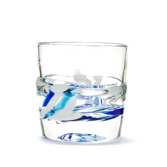 Load image into Gallery viewer, Hand blown glass whiskey glass, clear with a swirl of cobalt blue, teal blue, and white glass on the bottom. Colour combination is called &amp;quot;Winter.&amp;quot;
