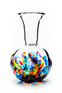 Hand blown glass vase. Red, blue, purple, and green glass on the bottom. Colour combination is called "Carnival."