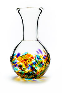 Hand blown glass vase. Purple, blue, green, pink, and yellow glass on the bottom. Colour combination is called "Spring."
