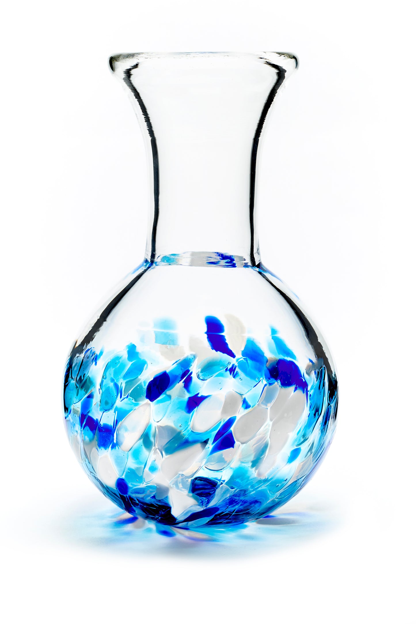Hand blown glass vase. Cobalt blue, teal blue, and white glass on the bottom. Colour combination is called "Winter."