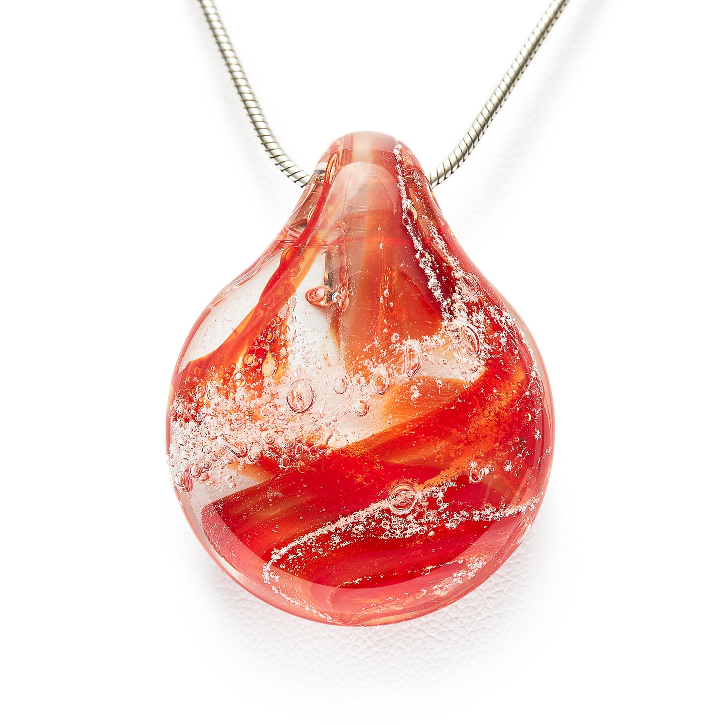 Memorial glass art pendant with cremation ash. Ruby red glass.
