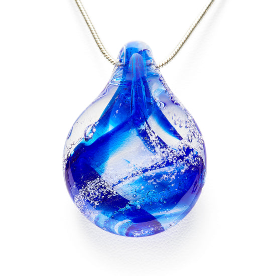 Load image into Gallery viewer, Memorial glass art pendant with cremation ash. Cobalt blue glass.
