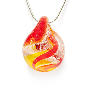 Memorial glass art pendant with cremation ash. Red, yellow, and orange glass. Colour combination is called "Sunburst."
