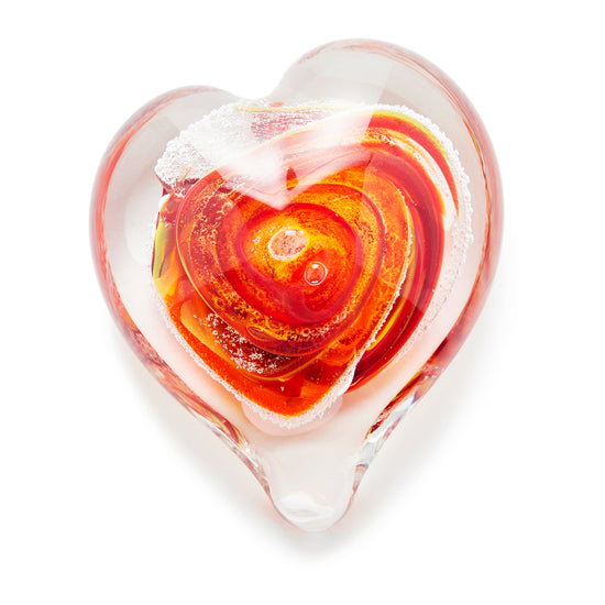 Memorial glass art heart paperweight with cremation ash. Red, yellow, and orange glass. Colour combination is called "Sunburst."