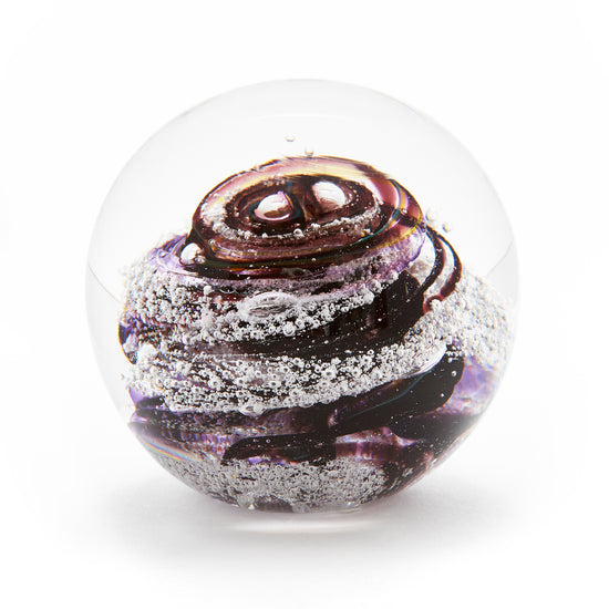 Load image into Gallery viewer, Round memorial glass art paperweight with cremation ash. Purple and cranberry glass. Colour combination is called &amp;quot;Amethyst.&amp;quot;

