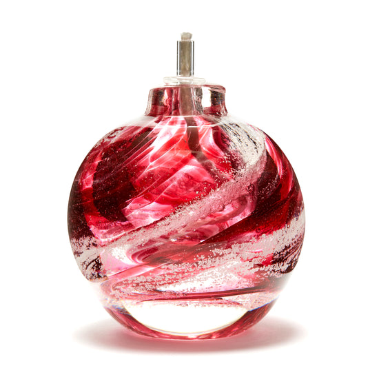 Round memorial glass art eternal flame oil lamp with cremation ash. Cranberry glass.