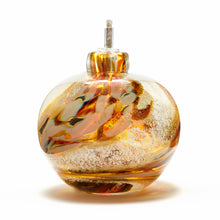 Load image into Gallery viewer, Round memorial glass art eternal flame oil lamp with cremation ash. Iris gold glass.