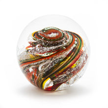 Load image into Gallery viewer, Round memorial glass art paperweight with cremation ash. Yellow, red, orange, and green glass. Colour combination is called &quot;Autumn.&quot;