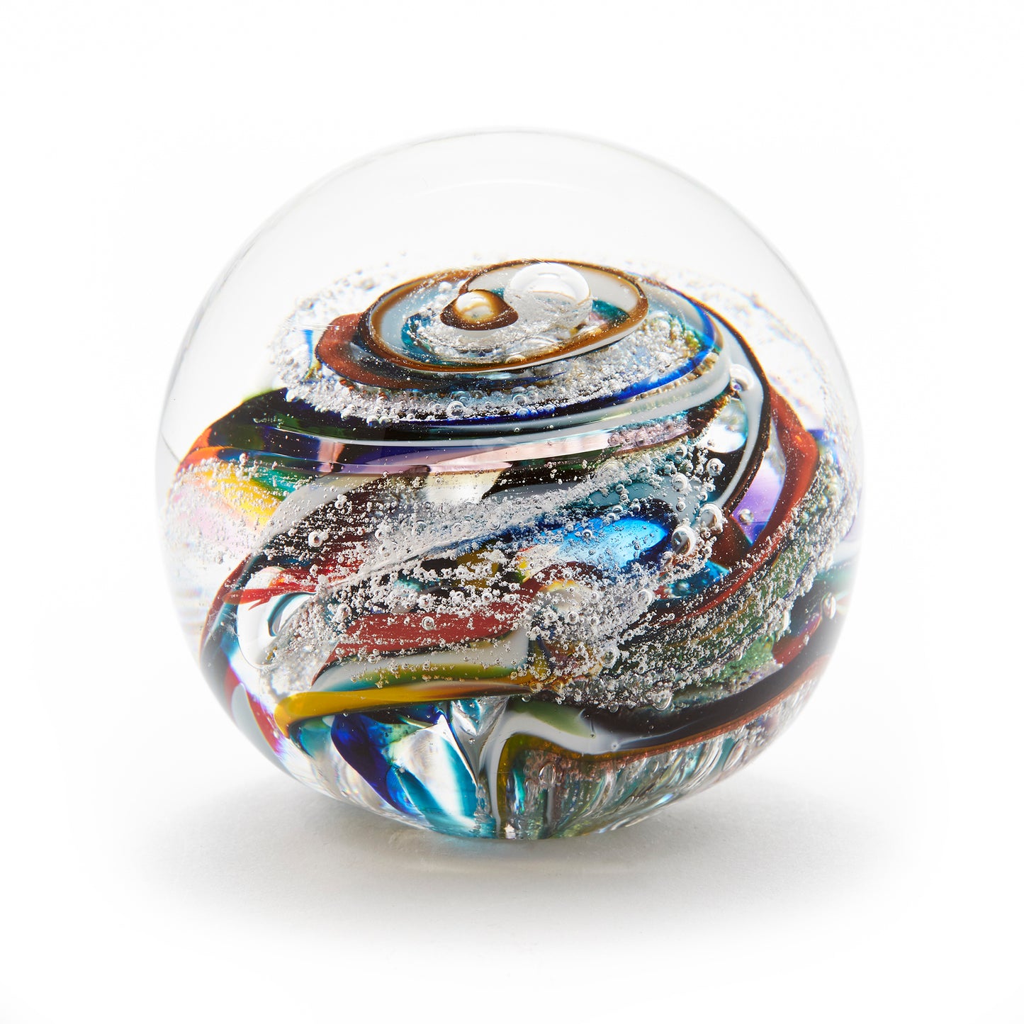 Load image into Gallery viewer, Round memorial glass art paperweight with cremation ash. Purple, blue, yellow, red, orange, green, and white glass. Colour combination is called &amp;quot;Multi.&amp;quot;
