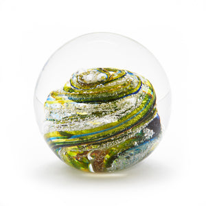 Round memorial glass art paperweight with cremation ash. Teal blue, yellow, and green glass. Colour combination is called "Summer."