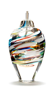 Memorial glass art tall eternal flame oil lamp with cremation ash. Purple, blue, yellow, red, orange, green, and white glass. Colour combination is called "Multi."