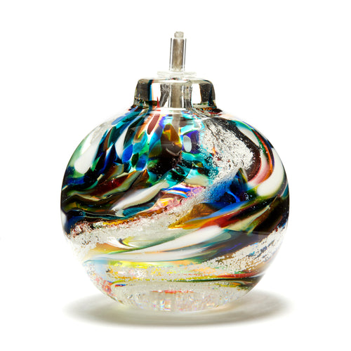 Round memorial glass art eternal flame oil lamp with cremation ash. Purple, blue, yellow, red, orange, green, and white glass. Colour combination is called 