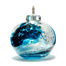 Load image into Gallery viewer, Round memorial glass art eternal flame oil lamp with cremation ash. Teal blue glass. Colour combination is called &quot;Ocean Wave.&quot;
