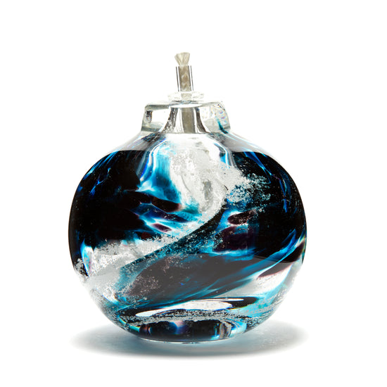 Load image into Gallery viewer, Round memorial glass art eternal flame oil lamp with cremation ash. Teal blue and purple glass. Colour combination is called &amp;quot;Amethyst Teal.&amp;quot;

