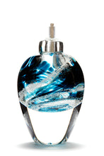 Load image into Gallery viewer, Memorial glass art tall eternal flame oil lamp with cremation ash. Teal blue glass. Colour combination is called &quot;Ocean Wave.&quot;
