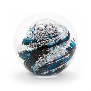 Round memorial glass art paperweight with cremation ash. Teal blue and purple glass. Colour combination is called "Amethyst Teal."