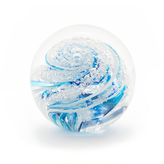 Load image into Gallery viewer, Round memorial glass art paperweight with cremation ash. Cobalt blue, teal blue, and white glass. Colour combination is called &amp;quot;Winter.&amp;quot;
