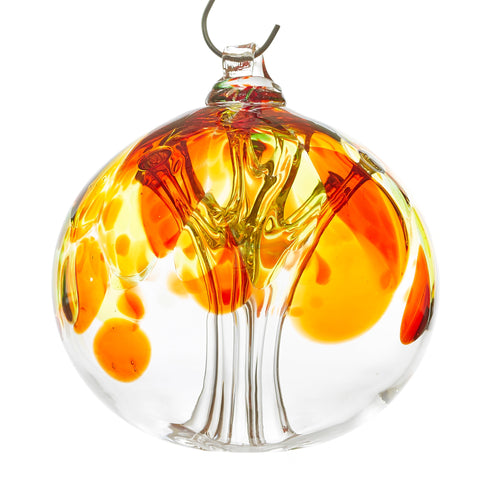 Hand blown glass tree of life ball. Yellow, red, orange, and green glass. Colour combination is called 