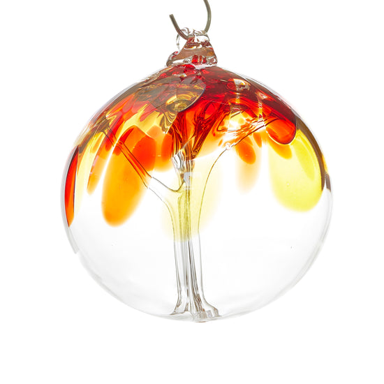 Hand blown glass tree of life ball. Red, yellow, and gold glass. Colour combination is called "Iris Fire."