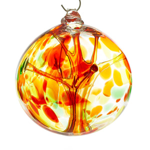 Hand blown glass witch ball. Yellow, red, orange, and green glass. Colour combination is called "Autumn."