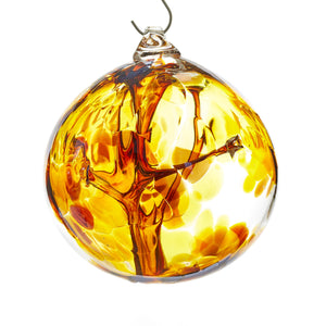 Hand blown glass witch ball. Iris gold glass.