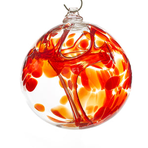 Hand blown glass witch ball. Ruby red glass.